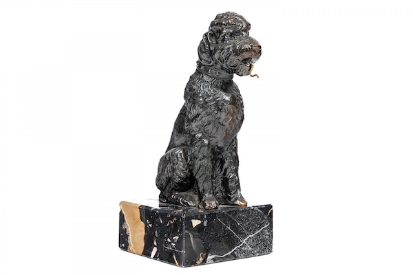 Vintage bronze sitting dog pocket watch holder on a marble plinth